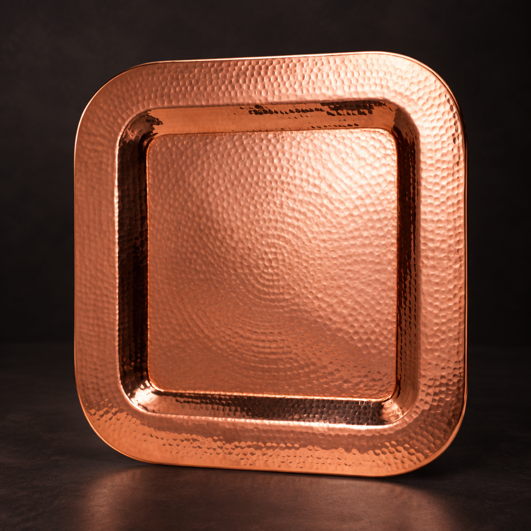 Thessaly square serving platter crafted from hand-hammered, polished copper with a radiant, durable finish.