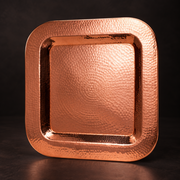 Thessaly square serving platter crafted from hand-hammered, polished copper with a radiant, durable finish.