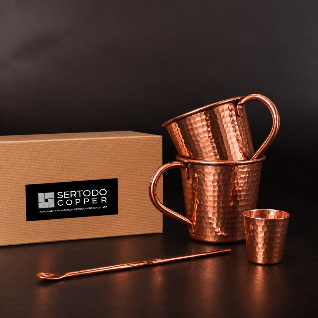 Hand-hammered solid copper Moscow Mule mugs, shot glass, and bar spoon set with an elegant eco-friendly gift box.