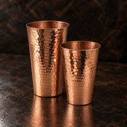 Elegant 16-ounce and 25-ounce hammered solid copper Boston cocktail shaker set for professional bar service.