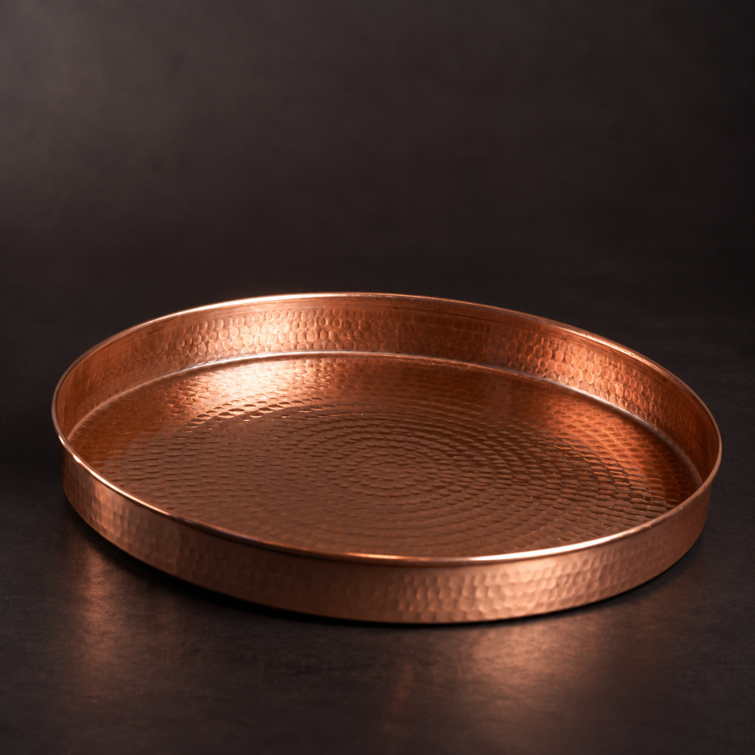 14-inch round hammered copper serving tray with a polished finish, perfect for elegant seafood or cocktail presentation.