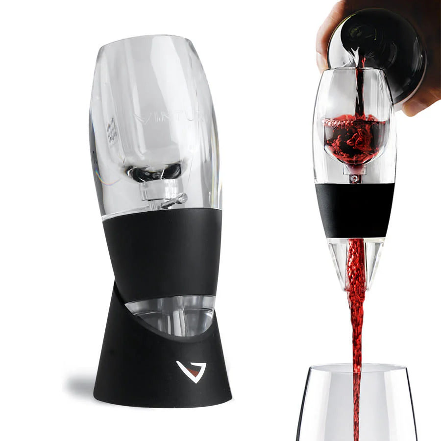 Clear Vinturi wine aerator with black stand and base, shown in use pouring red wine.
