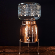Niagara Copper Water Dispenser with Lid - in use