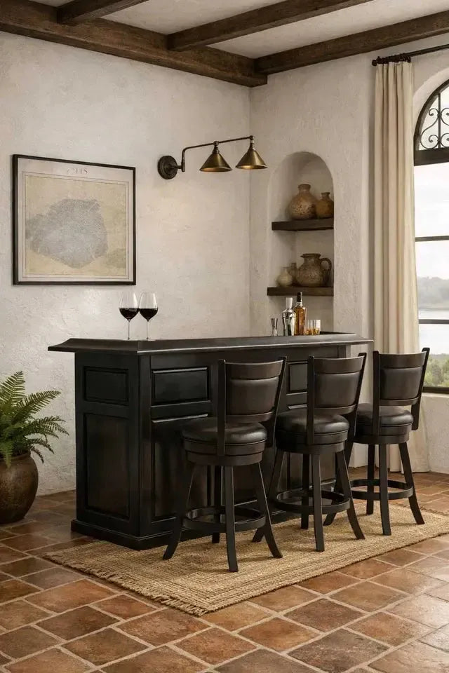 Dark wood English pub-style dry bar with three matching bar stools on a woven rug.