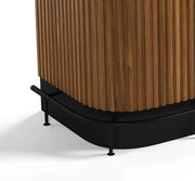 Matte black metal foot rail with adjustable levelers, complementing a wooden Prohibition Series cocktail bar.