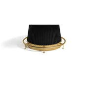 Polished brass metal footrail with adjustable levelers for a Prohibition Series poker table.