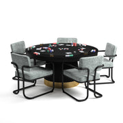 60" RAM Game Room Prohibition Series poker table with matte black wood base, brass kick plate, and grey chairs.