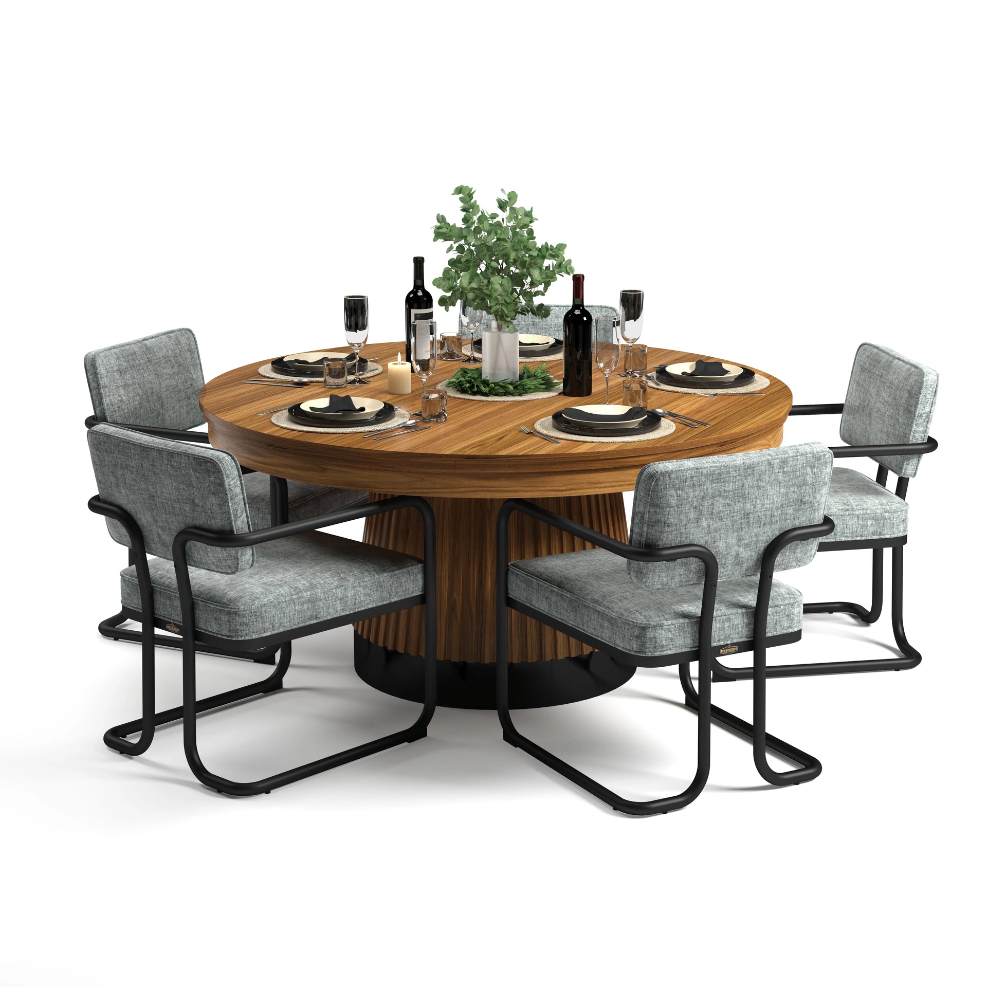 Round wooden dining table with fluted base, set with black dishes, wine, and six gray upholstered chairs.