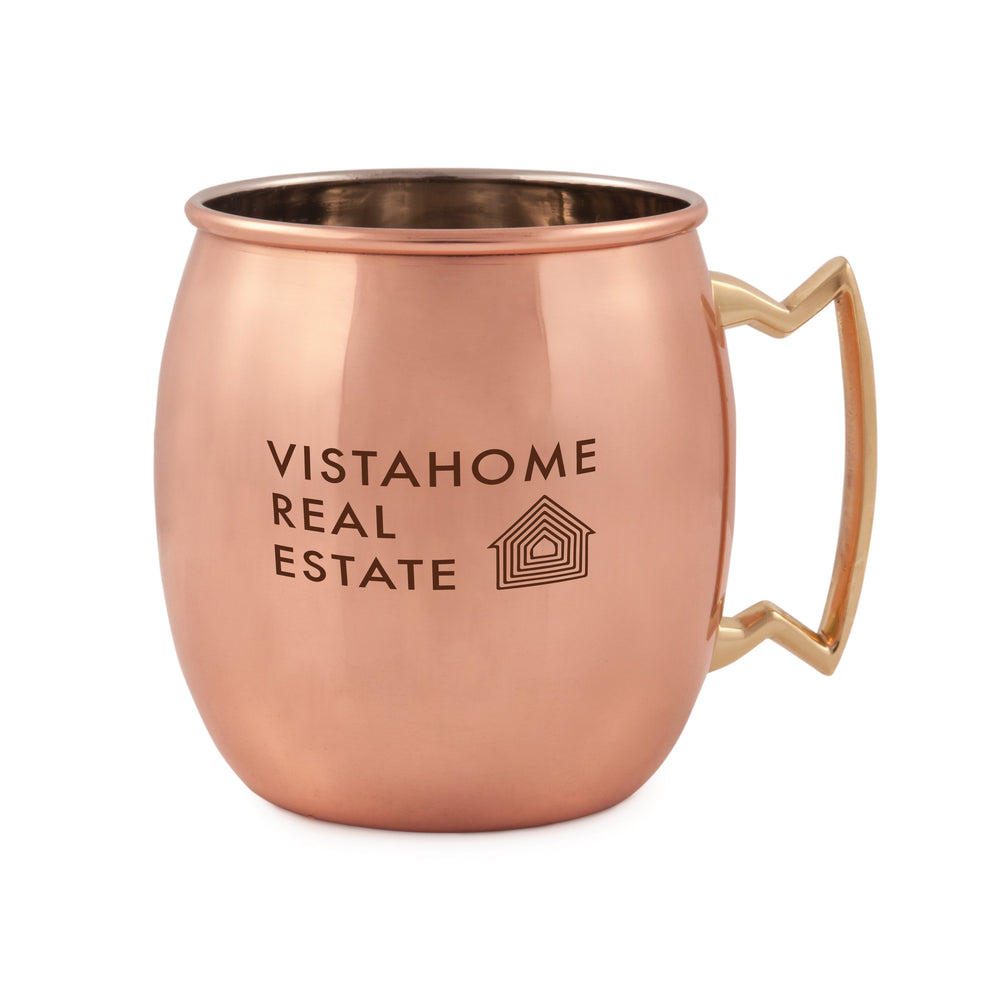 16 oz polished copper Moscow Mule mug with a brass zig-zag handle and custom VistaHome Real Estate logo.