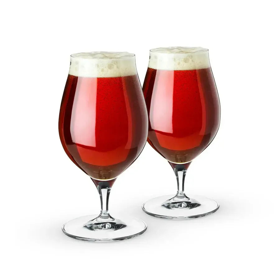 Set of 2 Spiegelau Barrel Aged Beer Glasses, clear lead-free crystal tulip glasses filled with dark beer.