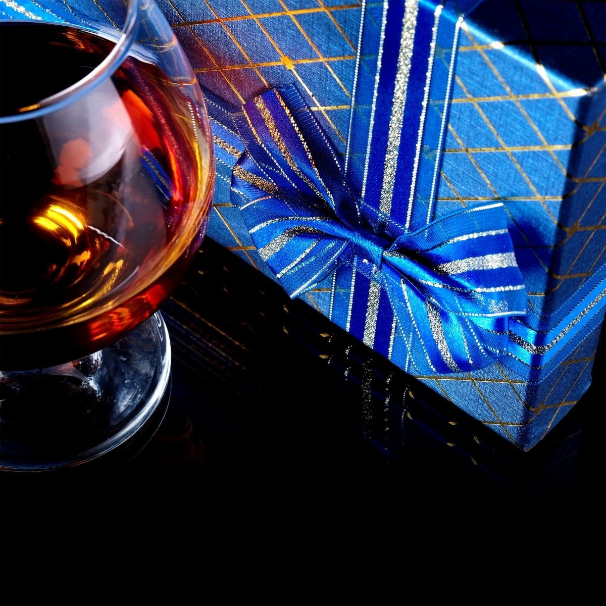 Curated bar gift set with wine decanter, coasters, and copper mug