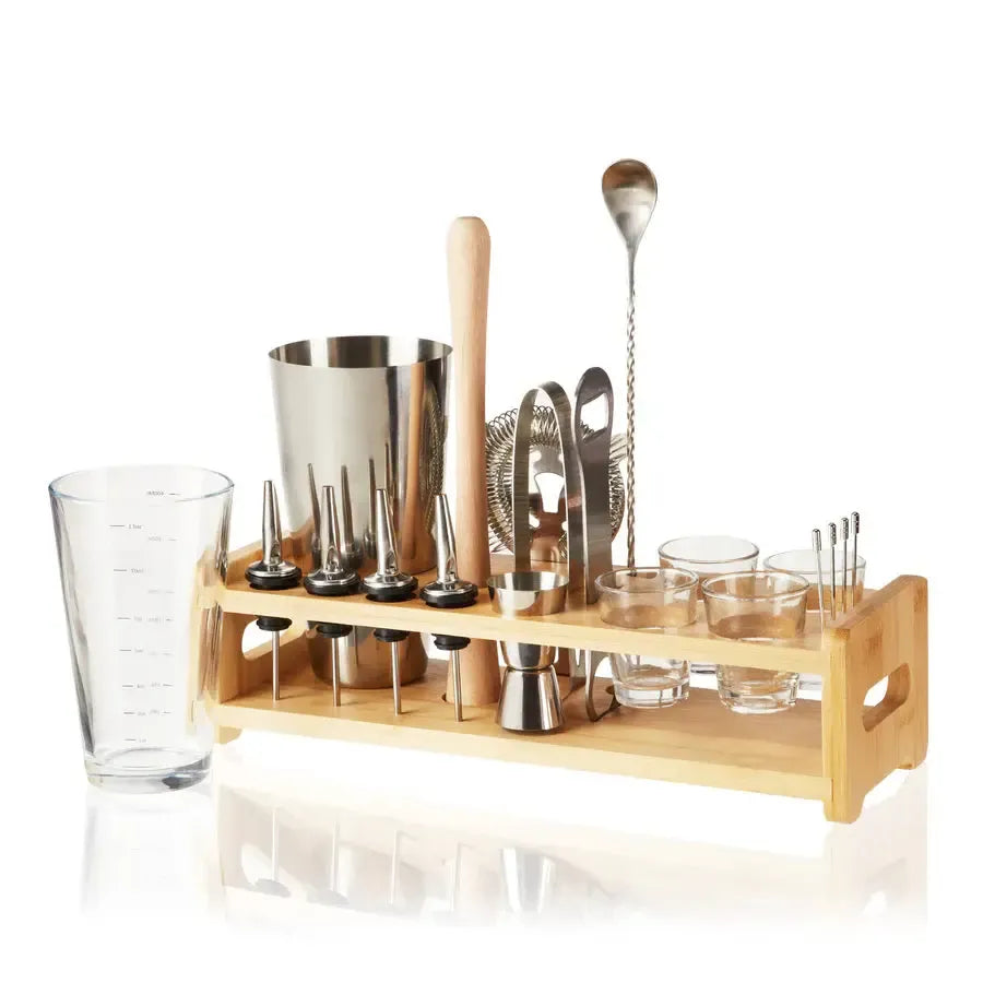 True 20-piece mixologist barware set with stainless steel tools, glass, and bamboo stand.