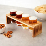 True Ardor Beer Flight Kit: Four 5oz glasses with different beers on a natural wood flight board.