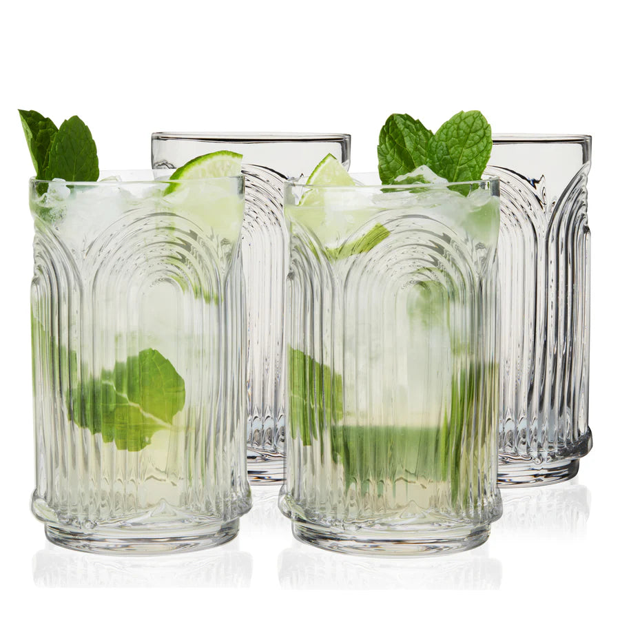 Set of 4 clear crystal highball glasses with repeating 3D arched Art Deco design, two filled with mojitos.