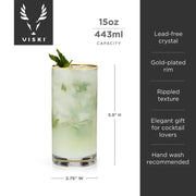 Viski Meridian 15oz lead-free crystal highball glass with gold-dipped rim and rippled texture, filled with a cocktail.
