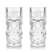 Set of 2 clear lead-free crystal tiki glasses with classic carved designs, reflecting light.