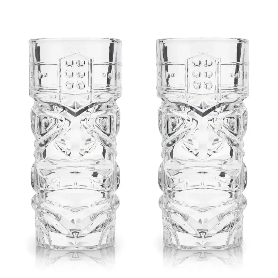 Set of 2 clear lead-free crystal tiki glasses with classic carved designs, reflecting light.